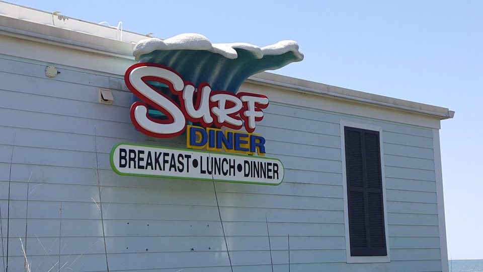 Beachfront diner with a patio and ocean view.