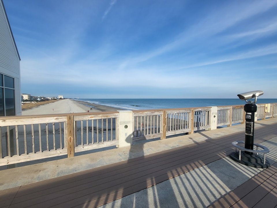 Wood-paneled dining room near the beach.